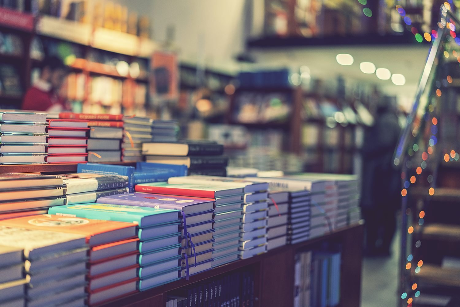Professionally published books on a table representing complete book publishing services
