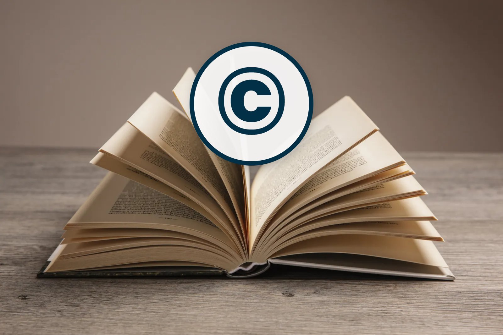 Copyright symbol above an open book, representing how to copyright a book